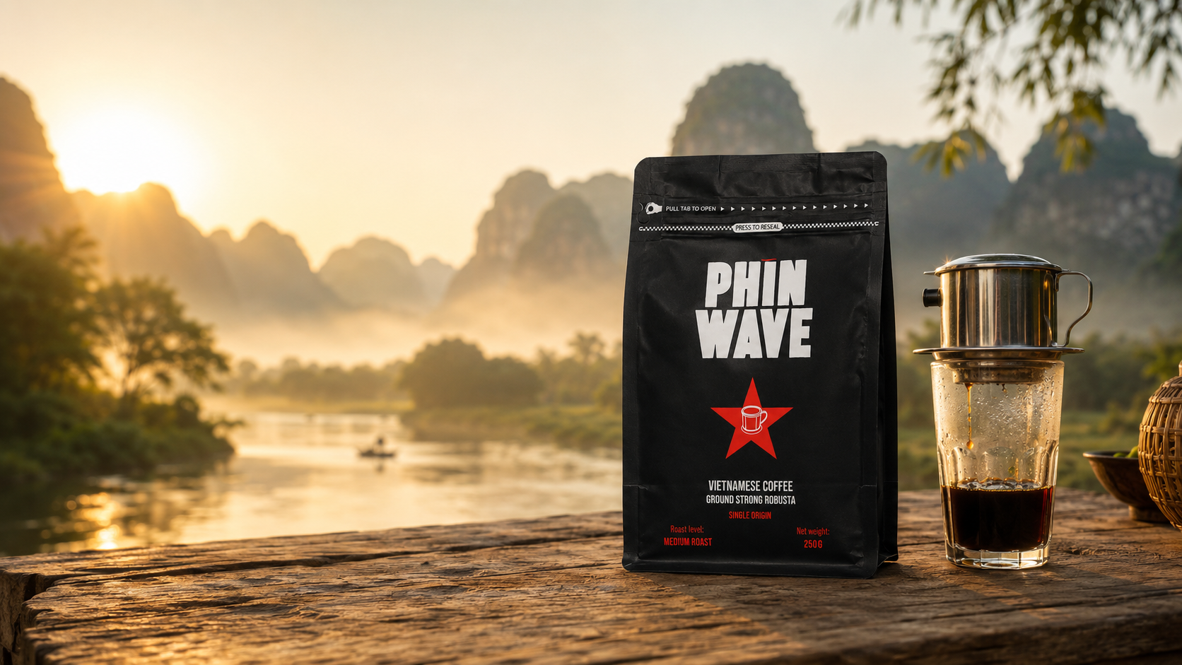 PHIN WAVE coffee package with a glass of coffee on a wooden table by a scenic lake.